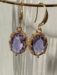 18k gold plated lilac purple lavender crystal diamanté ornate deep set oval crystal cabochon drop charm earrings many others colours in the range  The earwires are nickel free,18k gold rhodium plated on a copper base metal Dainty Oval Tarnish Resistant Jewelry, Elegant Purple Jewelry For Formal Occasions, Gemstone Drop Earrings As A Gift For Her, Elegant Gold Faceted Crystal Earrings, Oval Gold-plated Gemstone Jewelry, Cubic Zirconia Drop Earrings For Jewelry Making, Oval Gemstone Gold-plated Jewelry, Oval Gold Plated Gemstone Jewelry, Elegant Metal Jewelry With Oval Pendant