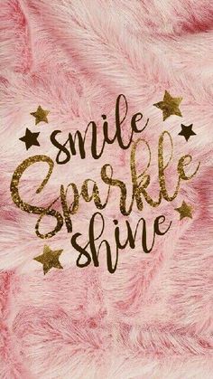 the words smile sparkle shine written in gold on pink fur