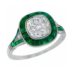 an antique diamond and emerald ring