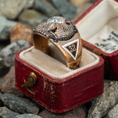 This great vintage mens 32° Masons ring features a diamond at the center of a white gold double eagle. The shoulders and shank of the ring are decorated with enameled masonic symbols. It is crafted in a patinated 10k yellow gold and is a size 8.5. We are not offering resizing due to the enameling. A small amount of enamel shows wear. Antique Enamel Rings For Formal Occasions, Antique Engraved Enamel Ring For Formal Occasions, Classic Enamel Hallmarked Rings, Classic Engraved Enamel Jewelry, Classic Engraved Enamel Ring For Formal Occasions, Vintage Formal Enamel Ring With Polished Finish, Vintage Enamel Ring With Polished Finish For Formal Occasions, Art Deco Enamel Rings For Formal Occasions, Diamond Rings Symbolic For Formal Occasions