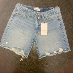 New With Tags! -Size 6 -Mid-Rise -Frayed -Five Pockets -Belt With Metal Button -Unfinished Hem -Front Zip With Metal Button Closure Measurements: Waist: 30” Length: 15 1/2” Inseam: 6 3/4” Distressed Short Jeans For Spring, Spring Ripped Short Jeans, Distressed Mid-rise Jean Shorts For Spring, Mid-rise Distressed Jean Shorts For Spring, Chic Denim Jean Shorts With Frayed Hem, Chic Denim Blue Jean Shorts With Frayed Hem, Chic Ripped Short Length Jeans, Spring Dark Wash Cutoff Jeans, Summer Distressed Straight Leg Jean Shorts