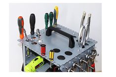 an assortment of tools are displayed on a metal rack