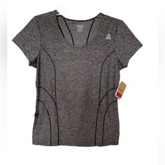 Designed With Active Woman In Mind, This Short-Sleeve Tee Is Is Made Of Moisture-Wicking Fabric For Dryness And Comfort. Its Slim Styling Is Designed To Move With An Active Body. Although It’s Reebok Color Is Called Black Heather, It Is More Of A Dark Gray Hue. Pit To Pit: 19” Neck To Hem: 24 1/2” Side To Side At Hem: 19” From A Smoke-Free Home. Gray Short Sleeve Tops For Light Exercise, Gray Casual Top For Light Exercise, Casual Gray Top For Light Exercise, Fitted Casual T-shirt For Running, Casual Gray Tops For Running, Sporty Gray Tops For Light Exercise, Green Bay Packers Shirts, Teal Shorts, Reebok Women