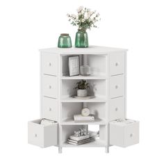 a white shelf with drawers and vases on top