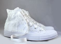 "Ivory Lace High Top Converses -- Ivory Floral Lace Bridal Converses -- Wedding Tennis shoes - Wedding Converse High Top-- Custom Converses For the girl who wears her Converses to every occasion.... why shouldn't you wear them to your wedding? Skip down the aisle in comfort in these beautiful MonoChrome Ivory lace Converses! Pictured in all white MonoChrome with Floral Ivory lace and Ivory ribbon shoelaces. Alternate ribbon shoelace colors are available upon request. Also available in white or c Wedding Tenishoes, White Lace Trim Closed Toe Wedding Shoes, White Lace-up Lace Wedding Shoes, Cream Lace-up Wedding Shoes For Ceremony, Cream Closed Toe Wedding Shoes With White Laces, Lace-up Wedding Shoes With Laces, Cream Wedding Shoes With White Laces, White Lace Wedding Shoes For Bride, White Lace Wedding Shoes