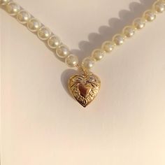 introducing our pearl ethereal necklace. the pearl ethereal necklace is made of 2mm dainty gold plated chain with 8mm white pearl beads and an 18k gold heart locket to fit a small picture of a loved one (23mm x 19mm). find us on - depop: @milanajewelry instagram: @milanaajewelry (usa shop) @milanajewelryaz (european shop)  tiktok: @milanajewelry Gold Heart Locket, Chestnut Hill, Aesthetic Retro, Heart Locket Necklace, Gold Bead Necklace, Pretty Necklaces, Heart Locket, Girly Jewelry, Dream Jewelry