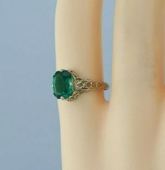 "14K White Gold Art Deco Filigree Green Stone Ring, 6x8mm center stone, 3/8\" across, pierced decoration, Ring size 4, 1.7 grams Stock # BB231R24 Most rings are sizable for a small fee. If the ring you are considering is the incorrect size contact us for a quote. This listing contains photographs of the actual item you will receive. Our items are in excellent condition with little or no signs of wear and many are one of a kind pre-owned estate finds. Please look closely at the pictures in this l Green Stone Ring, Art Deco Filigree, Green Stone Rings, Gold Art Deco, Fine Jewelry Designers, Boston Ma, Gold Art, Size 10 Rings, Blue Topaz Ring