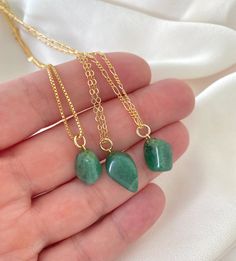 **Each piece in my shop, I personally create and photograph. (All photos are property of The Cord Gallery LLC) Thank you for supporting my small business.All Natural Aventurine Pendant NecklaceAdd a pop of green to your accessories with these pretty pendant necklaces! Features genuine Aventurine Gemstones, tumbled to a smooth, asymmetrical size and finish. Adorned on your choice of chain in the length of your choosing. Chain Options:Gold Filled Link ChainGold Filled Box ChainGold Filled Figaro C Green Aventurine Necklace, Aventurine Necklace, Pretty Pendant, Gold Charm Necklace, Green Crystal, Green Crystals, Green Aventurine, Gold Filled Chain, Box Chain