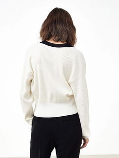 MO&Co. Women's Ribbed Knit Contrasting Cardigan Features : - Loose fit, drop shoulder- Ribbed knit finish- Contrasting design Code: MBB3CART04The back length of size S is 49.5cmMATERIALS & CARE Material: 72.8% Lyocell 27.2% PolyesterNot water wash, do not bleachSpread out in the shade to dry, do not tumble dryLow temperature iron, professional dry cleaningNotice:1. Wrap the metal parts before dry cleaning2. Ironing the padded cloth in the contrasting color partPlease select your own size in the Knit V-neck Cardigan With Ribbed Collar, Chic Crew Neck Cardigan With Ribbed Cuffs, Oversized Ribbed Crew Neck Cardigan, V-neck Knit Cardigan With Ribbed Collar, Chic Knit Cardigan With Ribbed Cuffs, Winter Knit Cardigan With Ribbed Neckline, Fall Knit Cardigan With Ribbed Neckline, Knit Cropped Sweater With Ribbed Cuffs For Work, Knit Top With Ribbed Cuffs For Work