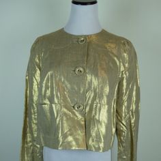 Whistles London Gold Metallic Linen Jacket / Top Size 8..Uk12..Fully Lined.. Covered Button Front.. Small Pockets Front..Fine Stitch Detail! Extra Button ...So Pretty And Versatile..Wear It Dress Up Or Down.. Made In Romania... Pleat In Back Gives You Some Extra Room .. Condition: New Without Tags Measures Sleeve 30 Bust 39 Hem Laying Flat Across 24 Includes Pleat Open Length 18 Chic Gold Blazer With Button Closure, Chic Gold Blazer With Buttons, Gold Blazer With Gold Buttons For Spring, Chic Gold Long Sleeve Blazer, Chic Spring Blazer With Gold Buttons, Gold Single-breasted Blazer For Evening, Gold Single Breasted Blazer For Evening, Gold Chic Single Breasted Outerwear, Tailored Gold Blazer For Spring