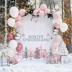 a pink and white winter wonderland themed backdrop