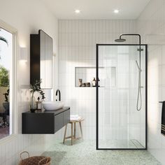 a bathroom with a walk in shower next to a sink