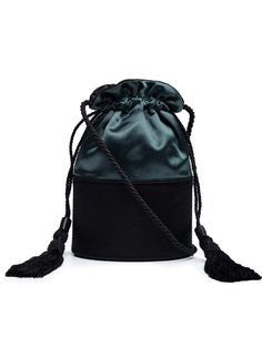 Hunting Season reimagines its Lola style in elegant proportions with a structured satin base and soft satin body with a twisted rope strap that echoes the tasseled pulls at the drawstring top. This drawstring bag showcases a satin strap with tassels perfect for a tailored feel. Fully lined. Handmade in Spain. Compositi Chic Bucket Shoulder Bag With Tassels, Elegant Black Bag With Tassels, Elegant Black Bags With Tassels, Elegant Bucket Bag With Braided Handles, Elegant Shoulder Bucket Bag With Braided Handles, Chic Evening Bucket Bag With Braided Handles, Elegant Formal Bucket Bag With Braided Handles, Elegant Evening Bucket Bag With Braided Handles, Elegant Tassel Pouch Shoulder Bag