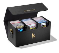 a black box with four compartments filled with cd's and folders in it