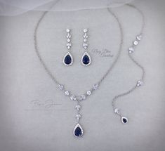 a necklace and earring set with blue stones