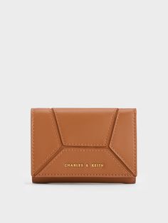 This product is made with at least 20% sustainable materials by weight. CHARLES & KEITH uses recycled, degradable, organic, and water-based materials in our eco-conscious collection.In a gorgeous shade of chocolate-brown, this Nasrin wallet will certainly please those with a penchant for neutral hues. The basic rectangular silhouette has been elevated by geometric panels stitched together to create a sleek yet eye-catching design. This wallet opens up to a well-compartmentalised interior, which Versatile Brown Wallets With Interior Card Slots, Modern Brown Rectangular Card Holder, Versatile Brown Wallet With Rfid Blocking, Versatile Brown Wallet For Gift, Versatile Brown Wallets For Gift, Versatile Brown Wallets For Gifts, Modern Brown Wallet For Gift, Modern Brown Wallets For Gift, Modern Brown Wallets For Gifts