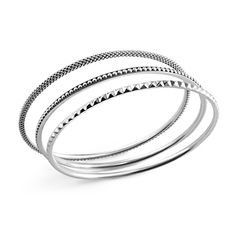 Three sterling silver round bangles join to form this versatile bracelet. Two bangles of Caviar beading and one with a sugarloaf motif. Elegant Stacked Sterling Silver Jewelry, Minimalist Stackable Bangle Beaded Bracelets, Minimalist Stackable Beaded Bangle Bracelets, Minimalist Stackable Beaded Bangle Bracelet, Sterling Silver Stackable Round Bracelet, Stackable Sterling Silver White Gold Bangle, Stackable White Gold Sterling Silver Bangle, Stackable Sterling Silver Bangle In White Gold, Stackable Sterling Silver Bracelet