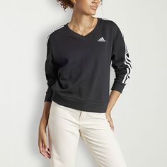 This women's adidas sweatshirt takes things up a notch with the brand's signature 3 stripes design. Cut for a regular-fit and made from comfortable 100% French terry cotton, it features a v-neck and long cuffed sleeves.Closure Type: Pullover HeadFit: Regular FitNeckline: V NeckSleeve Length: Long SleeveSleeve Style: Cuffed SleeveApparel Length: 25 InchesFiber Content: 100% CottonFabric Description: French TerryCare: Machine Wash, Dry FlatCountry of Origin: Imported Adidas Logo Athleisure Tops With Relaxed Fit, Relaxed Fit Sportswear Activewear With Three Stripes, Adidas Cotton Sweatshirt With Three Stripes, Adidas Three Stripes Sportswear Sweatshirt, Adidas Relaxed Fit Athleisure Activewear, Adidas Athleisure Activewear In Relaxed Fit, Cotton Activewear With Three Stripes In Relaxed Fit, Sportswear Top With Three Stripes And Relaxed Fit, Three Stripes Relaxed Fit Sportswear Top