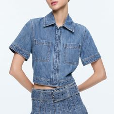 You can never have too much denim (this is a fact!). And our Tesha top is here to prove it with a short sleeve, cropped length, button front closure and front pockets. It's a perfect pairing for, well, more denim. And whatever else you wish. Denim top Button front closure with hidden placket Collared Short sleeve Cropped Front pockets 100% cotton Dry clean only Imported Model is wearing a size Small and her measurements are 5’10”, 32” bust, 23” waist, 34” hips Length from the shoulder: 18" Fits Short Sleeve Denim, Alice And Olivia, Maxi Skirts, Prove It, British Indian, Denim Top, Hip Length, Too Much, Perfect Pair