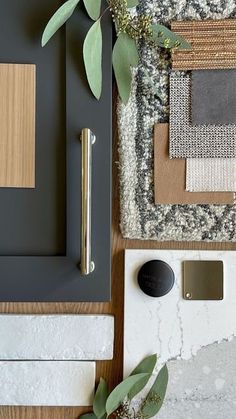 an overhead view of a table with various items on it, including paint and rugs