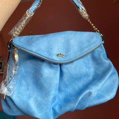 Nwt Juicy Couture Blue Crossbody Purse Bag Color: Glacier Blue Features Zippered Front Flap That Has A Deep Pocket That Is The Full Length Of The Bag Also Features Large Main Compartment With Magnetic Closure As Well As A Zippered Pocket And Two Slip In Pockets The Rear Of The Bag Also Has A Pocket With Magnetic Closure Approx 13.5”L X 11”H X 4”D Smoke Free Home. The Bag, Purse Bag, Crossbody Purse, Magnetic Closure, Juicy Couture, Front Zipper, Purses Crossbody, Blue Gold, Full Length