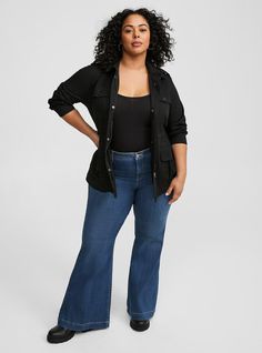 FIT Model is 5'10” wearing size 2. . Measures 32” from shoulder (size 2). MATERIALS + CARE Stretch twill woven and knit mixed fabric. . 75% polyester, 25% cotton. Machine wash cold. Line dry. . Imported. . DETAILS Collared neckline. . Front pockets. . Long sleeves. The best plus size women's stretch twill anorak jacket anoraks in deep black made of twill. Torrid is your destination for cozy fall and winter clothes to keep you warm and comfortable. Stretch Button-up Fall Outerwear, Stretch Button-up Outerwear For Work, Stretch Button-up Outerwear For Fall, Casual Stretch Button-up Outerwear, Black Utility Tops For Fall, Anorak Jacket, Knit Sleeve, Deep Black, Winter Clothes