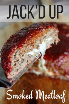 a close up of a piece of meatloaf on a cutting board