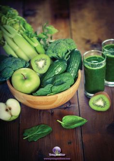 green smoothies and fresh fruits on a wooden table