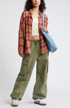 Perfect your '90s grunge aesthetic with an oversized, layer-ready button-up shirt made from lightweight plaid flannel. Front button closure Spread collar Long sleeves with button cuffs 55% cotton, 45% rayon Machine wash, tumble dry Imported Not available for sale and shipment to Germany Flannel Shirt With Cargo Pants, Trendy Plaid Flannel Shirt With Pockets, Oversized Plaid Flannel Shirt With Pockets, Casual Relaxed Fit Flannel Shirt, Oversized Plaid Flannel Shirt Casual, Casual Plaid Cotton Flannel Shirt, Casual Cotton Flannel Shirt With Pockets, Trendy Relaxed Fit Flannel Shirt With Pockets, Casual Relaxed Fit Flannel Shirt For Spring