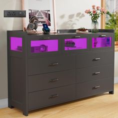 an image of a dresser with purple drawers