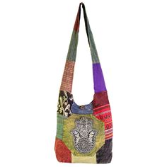 Ward off bad vibes wherever you go with this shoulder bag stitched with an ancient symbol of strength and protection. Patches of boho printed cotton are beautifully constructed into one unique shoulder bag featuring an embroidered Hamsa on the front, a zippered closure with loop and button, a large main compartment with one zippered inner pocket, and a thick strap which can be worn on the shoulder or crossbody. Bohemian Cotton Canvas Shoulder Bag, Multicolor Embroidered Cotton Shoulder Bag For Everyday Use, Bohemian Cotton Shoulder Bag With Multicolor Embroidery, Bohemian Multicolor Embroidered Cotton Shoulder Bag, Everyday Multicolor Embroidered Cotton Shoulder Bag, Bohemian Patchwork Cotton Shoulder Bag, Bohemian Shoulder Bag With Multicolor Embroidery, Bohemian Cotton Crossbody Bag, Bohemian Cotton Patchwork Shoulder Bag