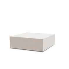 a white box sitting on top of a white surface with no one around the edge