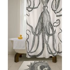 an octopus themed shower curtain and rugs