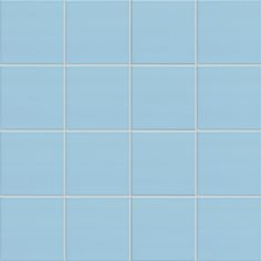 a blue tiled wall with white and light blue tiles on the bottom, one tile is missing