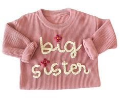 This Big Sister sweater is almost too cute to handle! It makes the perfect addition to family photos or to help announce a new baby sibling! Wherever your little one decides to wear this sweater, she'll definitely be showing how proud she is to be a Big Sister! Cute Long Sleeve Knitted Top, Big Sister Sweater, Playful Letter Print Sweater For Fall, Cute Cotton Soft Knit Sweater, Playful Long Sleeve Sweater With Letter Print, Cute Long Sleeve Soft Knit Tops, Cute Letter Print Winter Sweater, Cute Winter Sweater With Letter Print, Spring Letter Print Knit Sweater