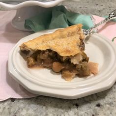 a piece of pie on a white plate