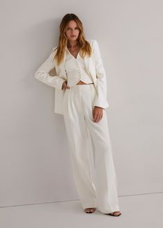 Everyone's favorite. (Hence, the name.) These tailored, best-selling beauties have a fluid wide-leg silhouette with a high waist and front pleats. Crafted from a blend suiting fabric with front pockets and a relaxed fit, these ivory trousers stand tall on their own but look especially sharp paired with the Favorite Blazer & coordinating vest.If you are between sizes, please size upInseam: 34"Rise: 12 3/4"67% POLYESTER 27% RAYON 6% ELASTANEInseam: 34"Model is 5'9" wearing size 2 Model is 5'10" we Suiting Fabric, Satin Pants, Single Button Blazer, Favorite Daughter, The Favorite, Blazer Buttons, Black Blazers, Colored Blazer, We Wear