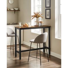 two stools and a table in a room