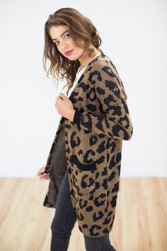 Cardigan LEO. A statement jacket on your closet that will upgrade any look of yours. Wear with a monochrome outfit and we promise it will keep you both warm and stylish. Loving the Leopard prints and side pockets of it. Long pattern to have you looking cool and cozy! For any other question please feel free to ask us! Materials Cotton 50 % Acrylic 50 % Model info bust 85 cm waist 61 cm hip 89 cm height 176 cm Model in photo wears a size S. Care Instructions Wash with similar colours. Do not tumbl Chic Brown Cardigan With Pockets, Trendy Open Front Sweater Coat For Work, Casual Leopard Print Winter Cardigan, Casual Leopard Print Cardigan For Winter, Trendy Black Cardigan With Pockets, Trendy Workwear Sweater With Pockets, Trendy Black Sweater With Pockets, Trendy Leopard Print Winter Cardigan, Trendy Leopard Print Cardigan For Fall