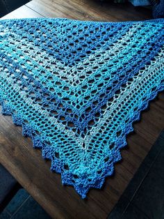 This handmade crochet shawl is available in three variations, each more striking than the last.  First is the Salt & Sea version, which is blues and whites. Embrace your inner sea witch anywhere with this striking blue gradient shawl. Reminiscent of the sea with crashing white caps and deep blue waters beneath, there is a metallic sheen running through the shawl. It's lightweight and delicate enough to breathe due to its 100% cotton material. Next is the Coastal Tides shawl, with its sandy beige Blue Crochet Yarn Shawl, Blue Crochet Shawl One Size, Crochet Shawl Patterns In Yarn, Crochet Yarn Shawl Patterns, Crochet Shawl Patterns With Yarn, Cotton Shawl, Summer Shawl, Gifts For Moms, Shawl Crochet