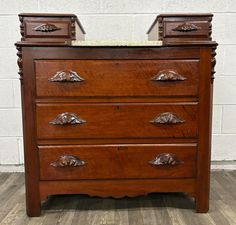 an old wooden dresser with four drawers