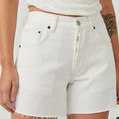 The Perfect Wear-Everywhere Pair From The We The Free Collection, These Shorts Are A True Essential In Any Denim Drawer. Featuring A Mid-Rise Fit, Relaxed Silhouette, Button-Fly Closure, And A Frayed Hem Detailing. 100% Cotton White Mid-rise Jeans With Built-in Shorts, White Straight Leg Shorts With Pockets, White Mid-rise Jean Shorts With Built-in Shorts, High Rise Cotton Shorts With Button Closure, White High Waist Bottoms With Button Closure, High Waist White Bottoms With Button Closure, White High-waist Bottoms With Button Closure, White Jean Shorts For Spring Everyday Wear, White Everyday Short Bottoms