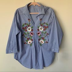 Gibson Latimer Nwt Striped Floral Embroidered Popover Blouse Collared Sz Medium New With Tags! Gorgeous Floral Embroidery On The Front, Popover, Collared, V Neck, 3/4 Sleeves, Blue And White Stripes. Size Medium Armpit To Armpit - 22.25" Length - 27.5" All Measurements Are Approximate And Taken While The Garment Is Laying Flat. Traditional Spring Workwear Tops, Spring V-neck Embroidered Shirt, Blue Floral Embroidered Blouse For Work, Blue Floral Embroidery Blouse For Work, Blue Floral Embroidered Workwear Blouse, V-neck Shirt With Floral Embroidery For Spring, Summer Embroidered Long Sleeve Top For Work, Embroidered Blue Blouse For Work, Blue Embroidered Blouse For Work