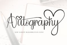 the word autography written in cursive writing