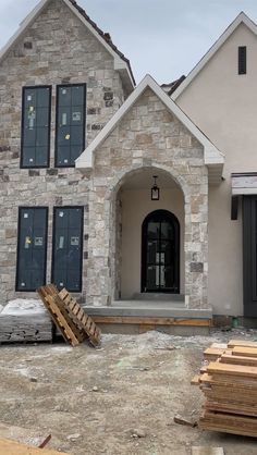 the front of a house being built with wood pallets