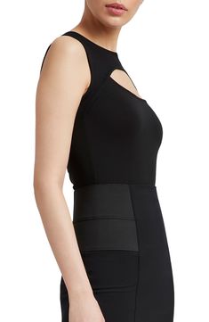 Rock a sleek night-out vibe in this sleeveless top designed with eye-catching cutouts and sheer accents. Jewel neck Sleeveless 96% Tencel® lyocell, 4% elastane with 95% viscose, 5% elastane sheer contrast Tencel lyocell is a more-sustainably produced fiber made with closed-loop processing Machine wash, line dry Imported Sleeveless Evening Tops With Built-in Bra, Modern Fitted Tank Top, Elastane Cutout Tops For Night Out, Chic Sleeveless Bodycon Top, Cutout Tops For Night Out, Night Out Cutout Tops, Modern Sleeveless Elastane Top, Sleeveless Bodycon Top For Evening, Night Out Tank Top With Built-in Bra