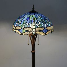 a table lamp with a dragonfly design on it