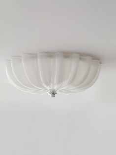 a white ceiling light hanging from the ceiling