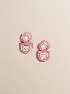 Elevate your style with our handmade multicolored statement stud earrings, a must-have accessory that will infuse joy and vibrancy into any outfit.  Crafted with care and attention to detail, these lightweight earrings boast a unique two-tone design that adds a playful pop of color to your ensemble. Whether you're dressing up for a special occasion, adding a touch of flair to your everyday look, or gifting them to your favorite fashionista, these earrings are the perfect statement piece.  Key Fe Bold Pink Jewelry For Gifts, Pink Retro Earrings For Gift, Trendy Pink Plug Earrings As Gift, Bold Pink Earrings For Party, Pink Geometric Earrings, Bold Handmade Geometric Earrings, Bold Pink Party Earrings, Pink Geometric Jewelry For Gifts, Geometric Pink Jewelry For Gifts