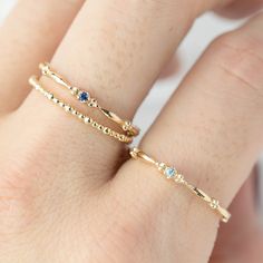 This dainty birthstone stackable ring is unlike any other, the band has a unique design all around which gives a bit of antique feel. Perfect gift for July birthdays! * Stock size: US 7 * Genuine 1.5mm blue sapphire * Band width: ≈1.75mm * Setting size: ≈2mm * Material: 14k solid yellow gold (rose gold or white gold option available) * Made of 100% recycled precious metal and ethically sourced gemstone * Comes in a gift box with a bow ready for gifting * Handmade with love and great care in New Fine Jewelry 14k Gold Filled Stackable Promise Rings, 14k Gold Filled Stackable Rings For Promise, 14k Gold Filled Stackable Rings As Promise Ring, Stackable Yellow Gold Jewelry With Blue Topaz, Stackable Yellow Gold Rings With Blue Topaz, Yellow Gold Stackable Rings With Blue Topaz, Yellow Gold Sapphire Stackable Rings With Bezel Setting, Fine Jewelry Stackable Birthstone Rings In Blue Topaz, Dainty Stackable Sapphire Ring For Anniversary